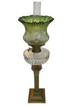 Vintage brass columned oil lamp with green shade, 74cm.