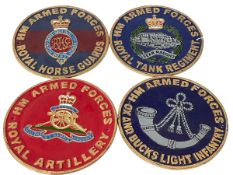 Four cast iron military plaques.
