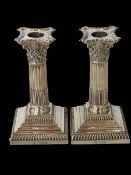 Pair Victorian silver corinthian column candlesticks with removable nozzles, London 1897, 15.5cm.