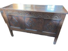 Antique oak three panel front coffer with carved front, 49cm by 127cm by 78cm.