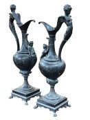 Pair of ewer candle holders, 63cm.