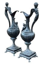 Pair of ewer candle holders, 63cm.