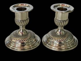 Pair Victorian silver spiral fluted candlesticks, London 1892, 8.5cm.