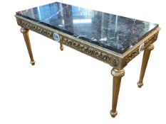 Ornate gilt coffee table with marble inset top and classical scene roundels, 45cm by 100cm by 52cm.
