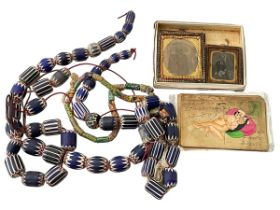 African glass trade beads, hand coloured karma sutra postcards and daguerreotype photographs.
