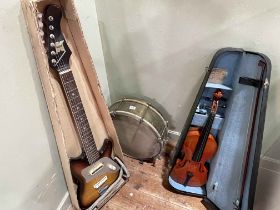 Violin with bow in case, electric guitar marked Kent, and a drum.