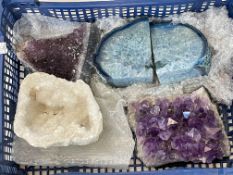 Collection of large mineral specimens including quartz bookends.