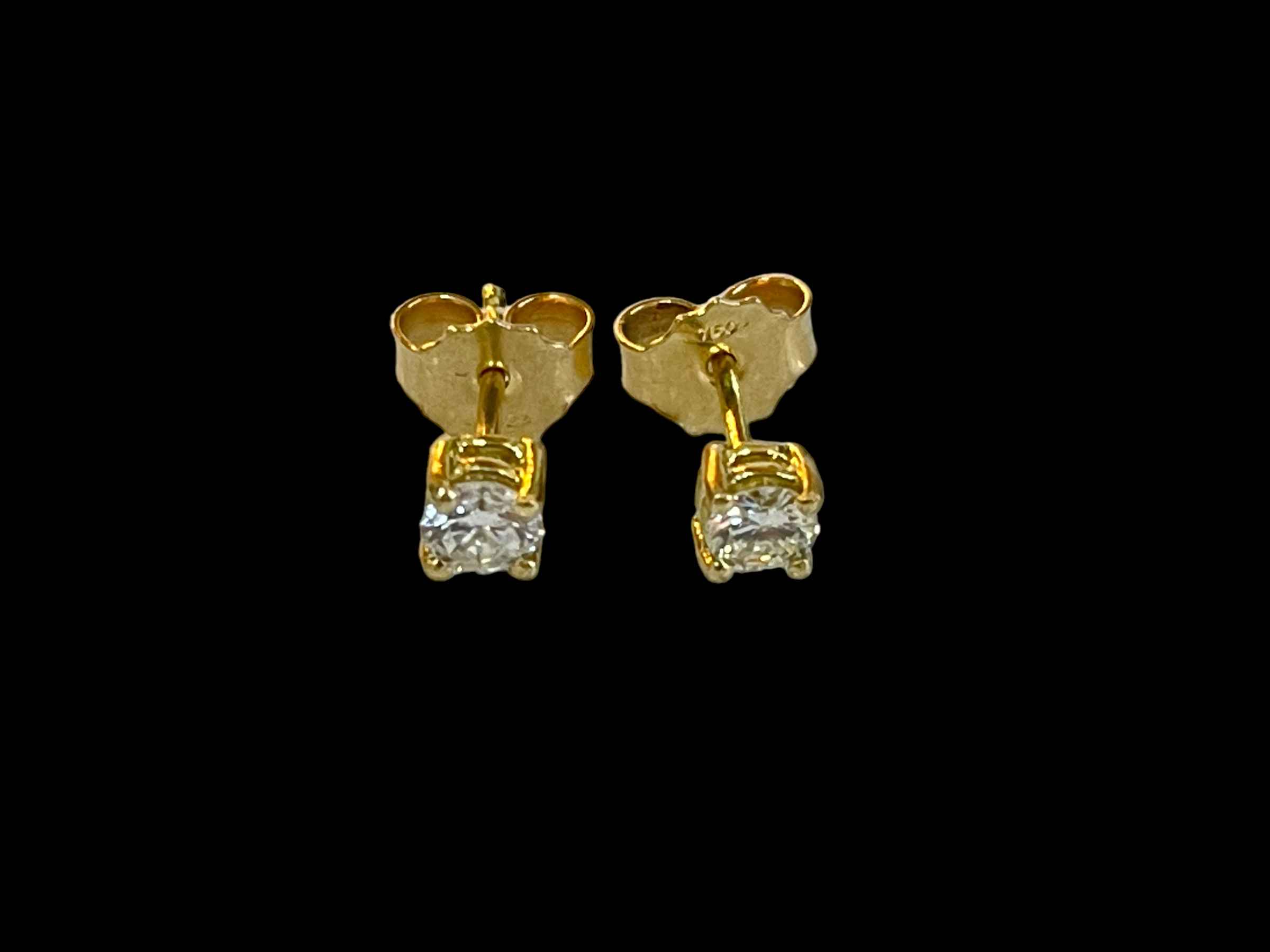 Pair of diamond stud earrings set in 18 carat yellow gold, diamonds approximately 0.40 carats.