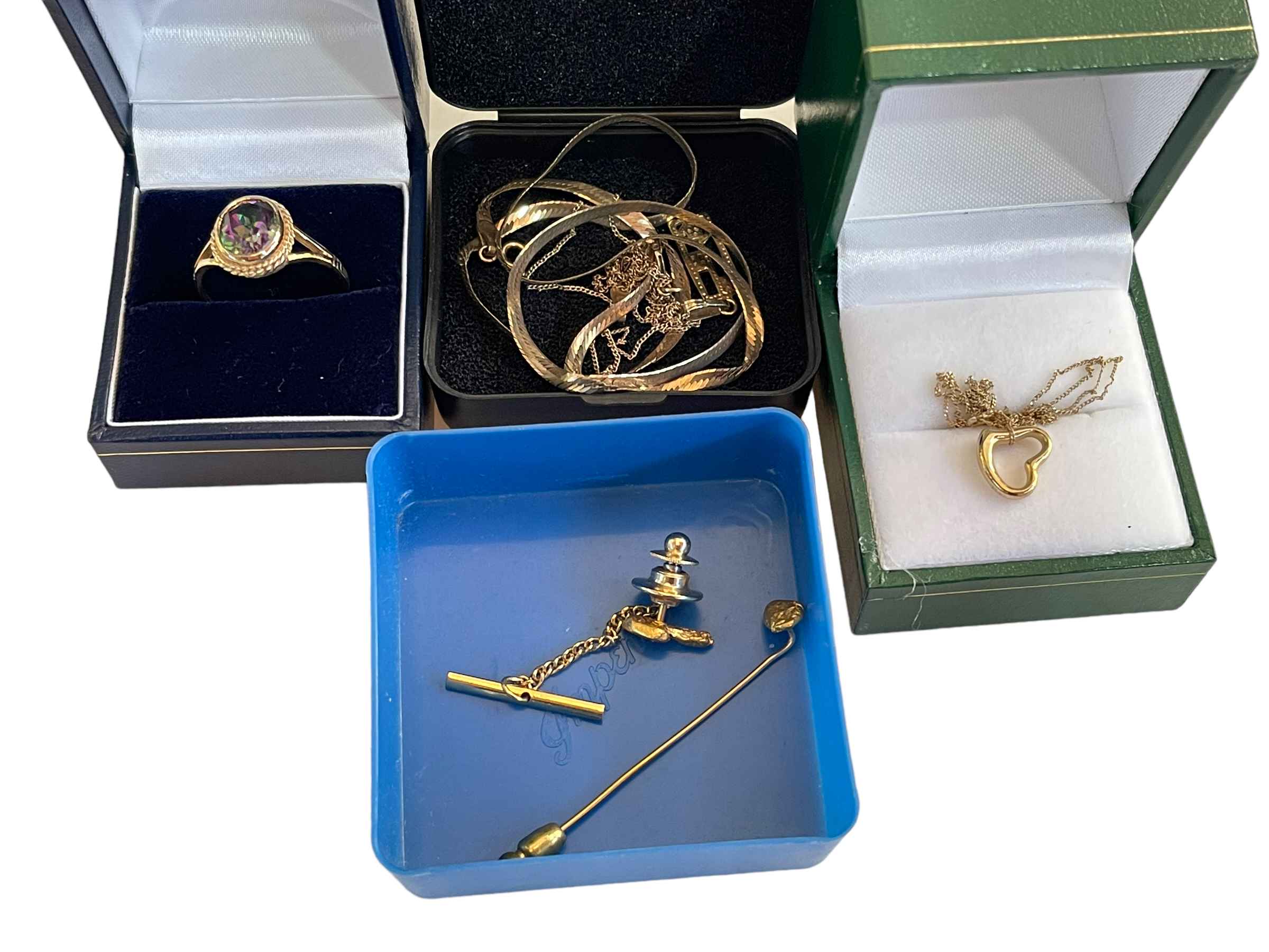 Gold jewellery including ring, necklace and tie pins.