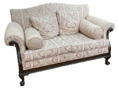 Mahogany framed Chippendale style two seater settee on ball and claw legs.