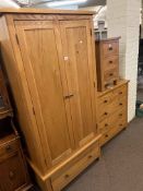 Contemporary oak three piece bedroom suite comprising two door wardrobe with base drawers,