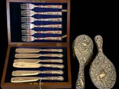 Cased set of silver handled fish knives and forks, and embossed silver brush and mirror.
