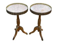 Pair Continental marble inset top and gilt mounted tripod wine tables, 57.5cm by 34cm diameter.