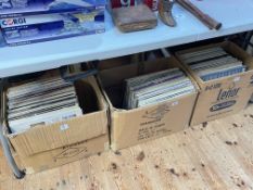 Three boxes of LP records.