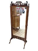 Mahogany framed cheval mirror with square reeded supports to fretwork and Queen Anne style legs,