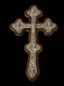 Silver mounted olive wood cross with embossed detail, 32cm by 21cm.