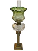 Vintage brass columned oil lamp with green shade, 74cm.