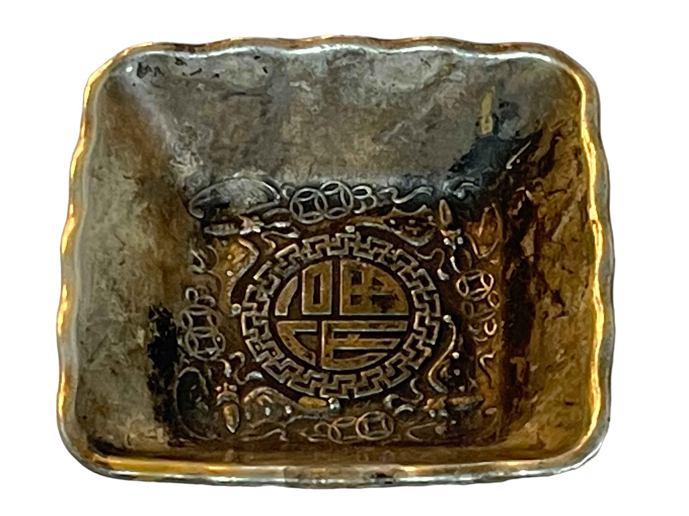 Chinese silvered dish on bronze, decorated with internal Buddhist emblem and dragons to the outer,