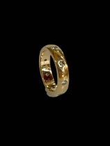 Diamond set 18 carat gold band ring, size K.
