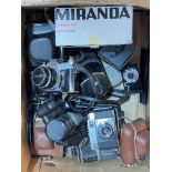 Box of assorted cameras including Canon.