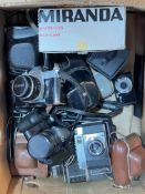 Box of assorted cameras including Canon.