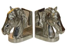 Pair of composite silver coloured horse head bookends, 23cm.