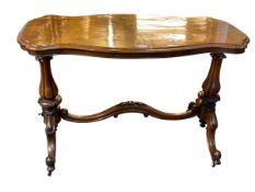 Victorian walnut rectangular shaped top side table on pedestal ends joined by curved stretcher,