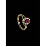 Ruby and diamond 9 carat gold ring, size O.