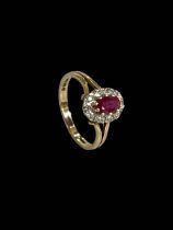 Ruby and diamond 9 carat gold ring, size O.