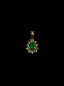 Emerald and diamond cluster pendant set in 18 carat yellow gold, emerald 0.55 carats, diamond 0.