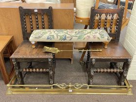 Pair carved oak bobbin back hall chairs, tapestry double footstool, brass fender and ash shovel (5).