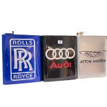 Three advert petrol cans, Rolls Royce, Audi and Aston Martin.