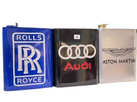 Three advert petrol cans, Rolls Royce, Audi and Aston Martin.