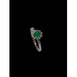 Emerald and diamond cluster ring set in 18 carat yellow gold, emerald 0.32 carats, diamond 0.