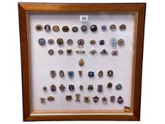 Collection of bowling related badges in glazed frame.