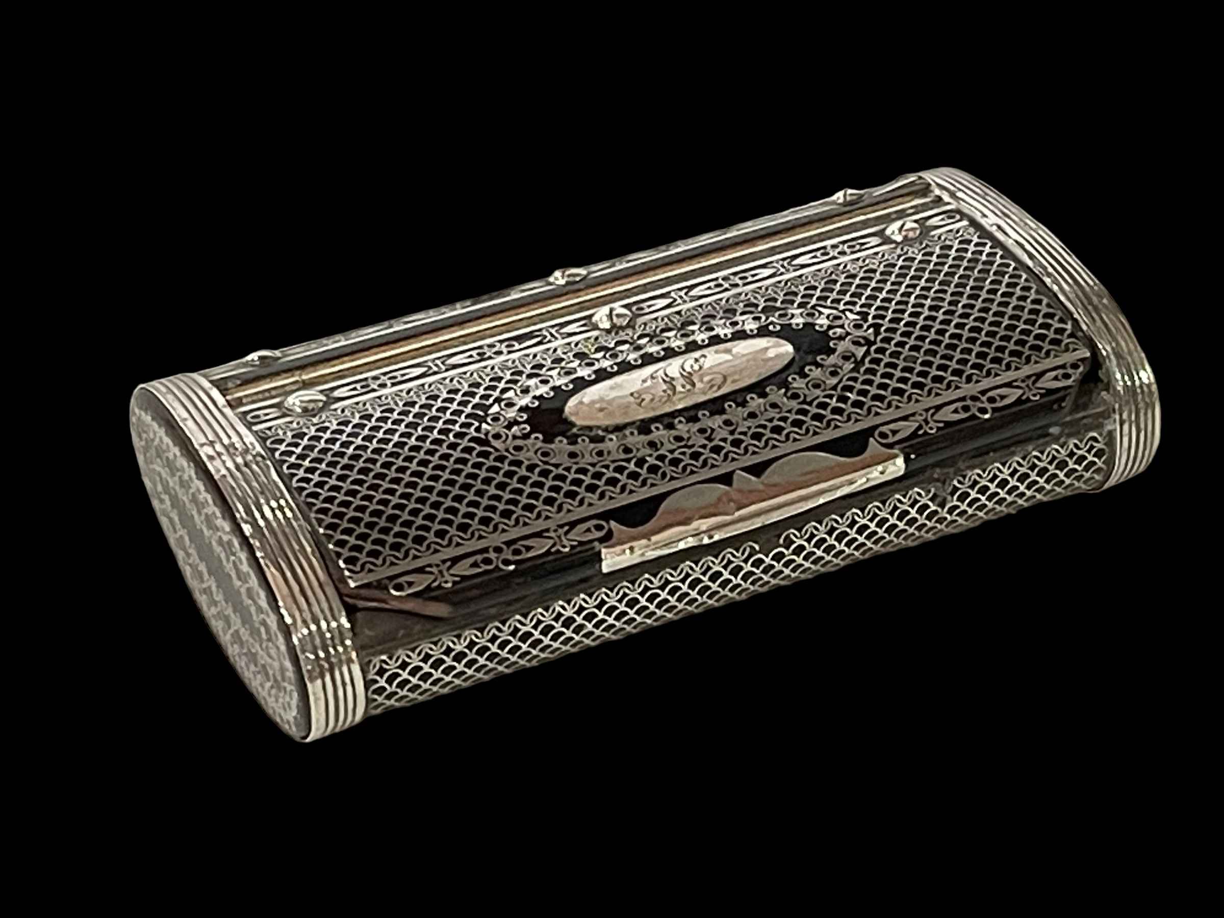 19th Century silver piqué work snuff box of oval section, 8.75cm across.