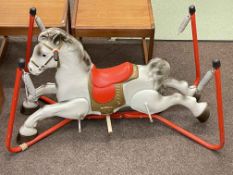 Vintage tin plate rocking horse and sprung safety stand.