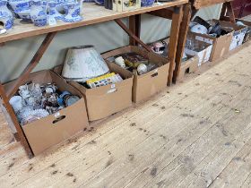 Eight boxes of decorative porcelain, glass, books, etc.