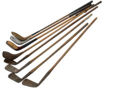 Collection of hickory shafted golf clubs.