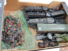 Collection of vintage tin plate train locomotives, lead figures, etc.