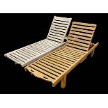 Two teak portable adjustable reclining sun loungers with slide out trays, 200cm by 61cm.