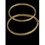 Two 9 carat gold bangles.