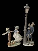 Two Lladro figurines, Lamplighter and The Scarecrow and the Lady, one boxed.