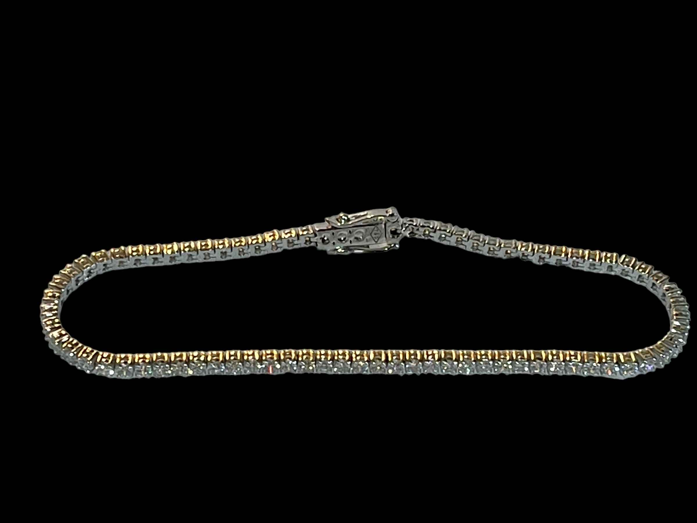 18 carat white gold and diamond tennis bracelet, diamond content over 3 carats.