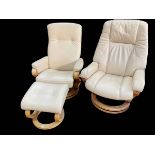 Two similar Himolla leather swivel reclining chairs and one footstool.