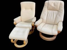 Two similar Himolla leather swivel reclining chairs and one footstool.