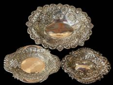 Three silver pierced bon bon dishes, London 1897, Chester 1896 and Birmingham 1905.