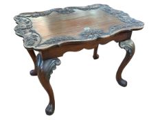 Mahogany shaped top low table having carved eagle head and floral border on cabriole legs,