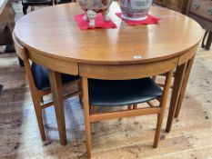 Vintage circular teak extending dining table with integral leaf and four space saver dining chairs,