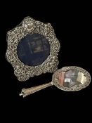 Ornate silver photograph frame and silver vanity mirror (2).